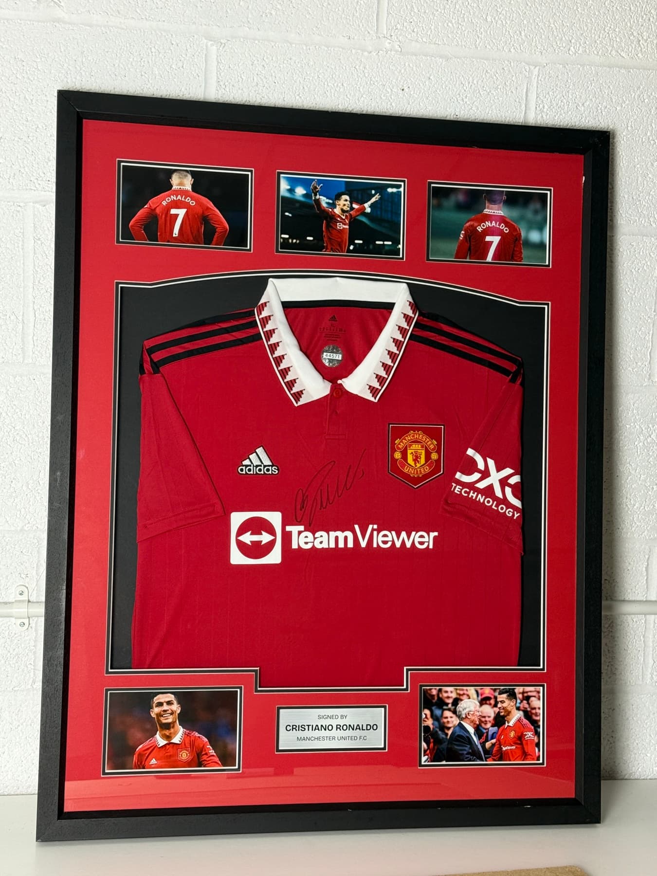 Signed Cristiano Ronaldo shirt framed in black and gold